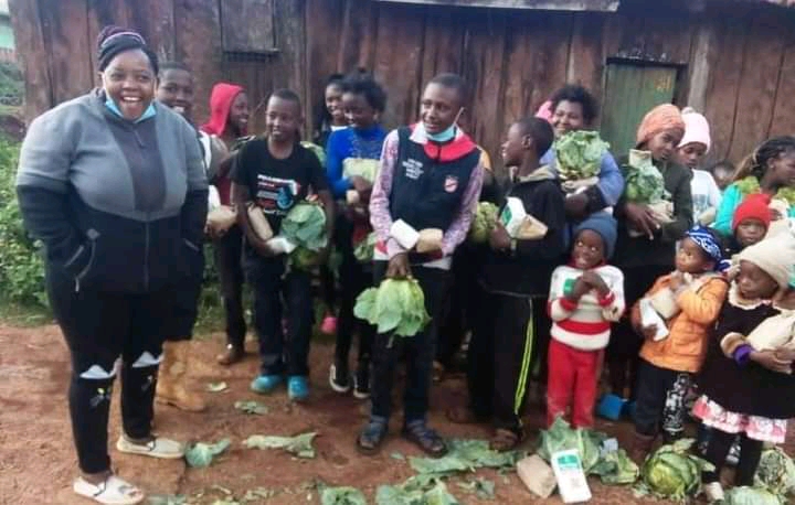 Beth with Group for feeding program